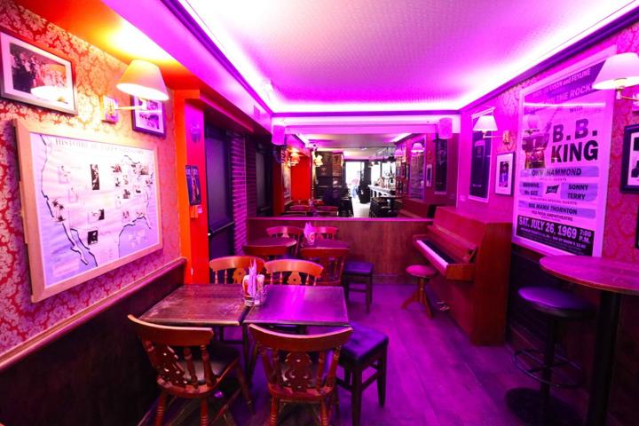 The back room with tables and projector screen